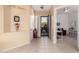 Bright and airy entryway with tile floors and access to office at 9345 E Hobart St, Mesa, AZ 85207