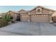 Two-car garage with desert landscaping at 9345 E Hobart St, Mesa, AZ 85207