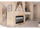 Gas fireplace with decorative mantel and shelving at 9345 E Hobart St, Mesa, AZ 85207