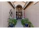 Inviting front entry with a decorative wrought iron door at 9345 E Hobart St, Mesa, AZ 85207