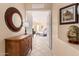 View of a hallway with a mirror, dresser, and glimpse of a bedroom at 9345 E Hobart St, Mesa, AZ 85207