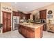 Kitchen boasts granite island and stainless steel appliances at 9345 E Hobart St, Mesa, AZ 85207