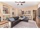 Relaxing living room with leather sectional sofa and fireplace at 9345 E Hobart St, Mesa, AZ 85207