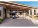 Relaxing covered patio with lounge chairs, perfect for outdoor entertaining at 9345 E Hobart St, Mesa, AZ 85207