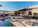 Inviting backyard oasis featuring a kidney-shaped pool and patio furniture at 9345 E Hobart St, Mesa, AZ 85207