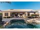 Home exterior showcasing a refreshing pool and spacious backyard at 9345 E Hobart St, Mesa, AZ 85207