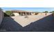 Large backyard with gravel landscaping and patio at 9719 W Pineridge Dr, Sun City, AZ 85351