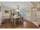 Bright dining room with wood floors and a light-colored table at 9719 W Pineridge Dr, Sun City, AZ 85351