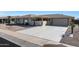 Single story home with a covered patio and desert landscaping at 9719 W Pineridge Dr, Sun City, AZ 85351