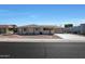 Single story home with a two car garage and desert landscaping at 9719 W Pineridge Dr, Sun City, AZ 85351