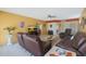 Living area with recliner chairs and view into kitchen and dining area at 9719 W Pineridge Dr, Sun City, AZ 85351