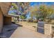 Brick BBQ and expansive grassy backyard with mature trees at 1019 E Belmont Ave, Phoenix, AZ 85020