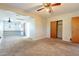 Bedroom with ceiling fan, carpet, and built-in shelving at 1019 E Belmont Ave, Phoenix, AZ 85020