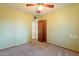 Simple bedroom with ceiling fan and closet at 1019 E Belmont Ave, Phoenix, AZ 85020