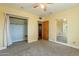 Bedroom with mirrored closet doors and carpet flooring at 1019 E Belmont Ave, Phoenix, AZ 85020