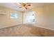 Large bedroom with ceiling fan, carpet, and window at 1019 E Belmont Ave, Phoenix, AZ 85020