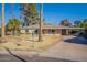 House with a carport and lawn in front at 1019 E Belmont Ave, Phoenix, AZ 85020