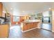 Open kitchen with island and granite counters at 1019 E Belmont Ave, Phoenix, AZ 85020