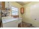 Laundry area with washer, sink, and cabinets at 1019 E Belmont Ave, Phoenix, AZ 85020