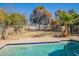 Inviting backyard pool with blue tile and spacious deck at 1019 E Belmont Ave, Phoenix, AZ 85020