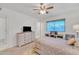 Bedroom with ceiling fan and built-in dresser at 10314 W Sun City Blvd, Sun City, AZ 85351