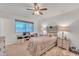 Simple bedroom with ceiling fan and neutral decor at 10314 W Sun City Blvd, Sun City, AZ 85351