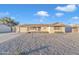 Ranch style home with gravel landscaping and a two-car garage at 10314 W Sun City Blvd, Sun City, AZ 85351