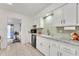 Clean and bright kitchen with granite countertops and light cabinets at 10314 W Sun City Blvd, Sun City, AZ 85351