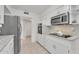 Clean kitchen with granite countertops and white cabinetry at 10314 W Sun City Blvd, Sun City, AZ 85351