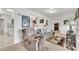 Cozy living room featuring a comfortable recliner and views into the kitchen at 10314 W Sun City Blvd, Sun City, AZ 85351