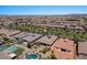 Aerial view of neighborhood homes, pools, and lush green landscaping at 10315 E Palladium Dr, Mesa, AZ 85212