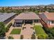 Aerial view showcasing a home's backyard oasis with a pergola and lush landscaping at 10315 E Palladium Dr, Mesa, AZ 85212