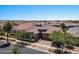 Aerial view of house showing landscaping, driveway and neighborhood view at 10315 E Palladium Dr, Mesa, AZ 85212