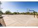 Outdoor basketball court with clear lines and tall light posts at 10315 E Palladium Dr, Mesa, AZ 85212