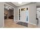 Bright and airy entryway with view into adjacent living room at 10315 E Palladium Dr, Mesa, AZ 85212