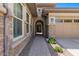 Brick walkway leads to a charming arched entryway at 10315 E Palladium Dr, Mesa, AZ 85212