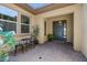 Inviting front entry with a blue door and small sitting area at 10315 E Palladium Dr, Mesa, AZ 85212