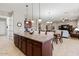 Large kitchen island with granite countertops and ample cabinet space at 10315 E Palladium Dr, Mesa, AZ 85212