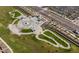 Aerial view of a community skate park with ramps, bowls, and green spaces at 10315 E Palladium Dr, Mesa, AZ 85212