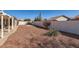 Landscaped backyard with gravel and covered patio at 11019 W Ventana W Dr, Sun City, AZ 85373