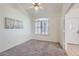 Well-lit bedroom featuring a ceiling fan and window at 11019 W Ventana W Dr, Sun City, AZ 85373