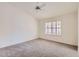 Cozy bedroom with large window and ceiling fan at 11019 W Ventana W Dr, Sun City, AZ 85373