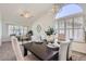 Formal dining room with a dark wood table and seating for four at 11019 W Ventana W Dr, Sun City, AZ 85373