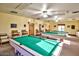 Well-equipped game room featuring billiard tables for recreation and entertainment at 11019 W Ventana W Dr, Sun City, AZ 85373