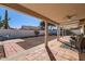 Covered patio overlooks a spacious backyard with gravel at 11019 W Ventana W Dr, Sun City, AZ 85373