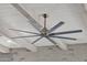 Modern ceiling fan with eight blades and exposed wood beams at 1115 E Gleneagle St, Chandler, AZ 85249