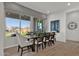 Bright dining room with wood table and backyard view at 1115 E Gleneagle St, Chandler, AZ 85249