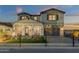 Two-story home with modern facade, two-car garage, and fenced yard at 1115 E Gleneagle St, Chandler, AZ 85249