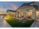 Two-story home with a front porch and landscaped yard at dusk at 1115 E Gleneagle St, Chandler, AZ 85249