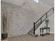 Modern staircase with metal railing and brick wall at 1115 E Gleneagle St, Chandler, AZ 85249